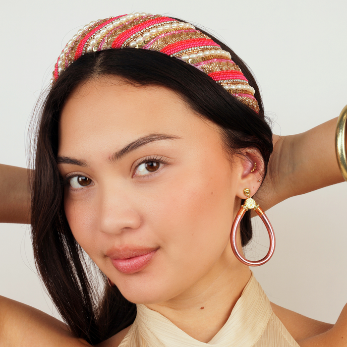 a woman with her hands behind her head