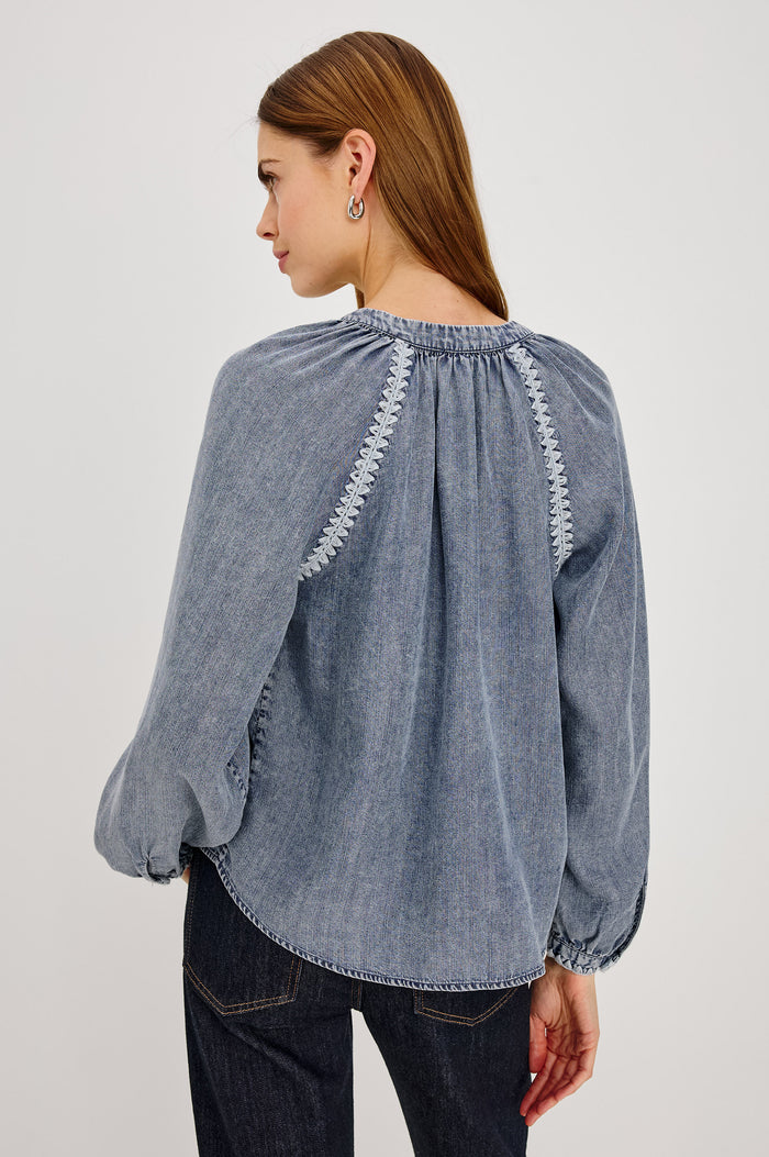 Tali Shirt in TENCEL™ Denim With Boxy Loose Fit, Blanket Stitch Trim, Raglan Sleeves, and Half Placket in Blue Ridge Colorway - Upper Body Back View Featured on Model