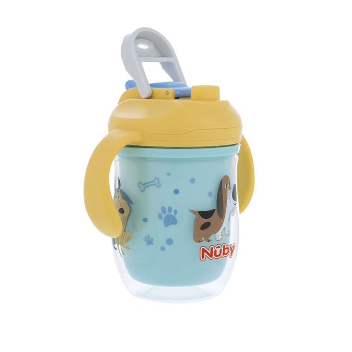 The Nuby 2-in-1 Insulated Toddler Cup | Dogs is blue with easy grip handles, a yellow flip-top spout lid, built-in handle for carrying, and features cartoon dogs, paw prints, and bones.