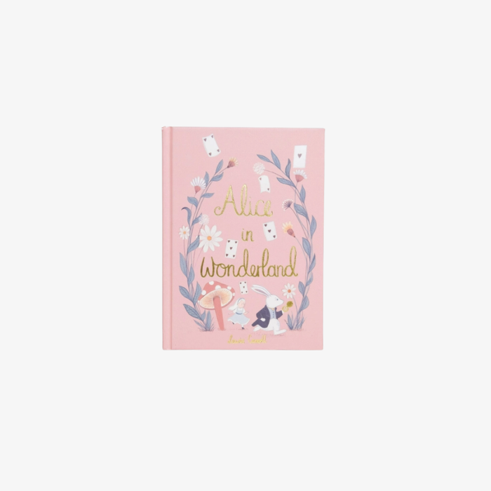 Pink book with 'Alice in Wonderland' design on a white background