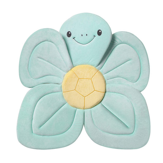 The Baby Bath Sink & Tub Cushion is a plush mat shaped like a smiling sea turtle, with a round yellow shell center and four teal flipper-like edges—perfect for making sink or tub bath time fun and comfy.