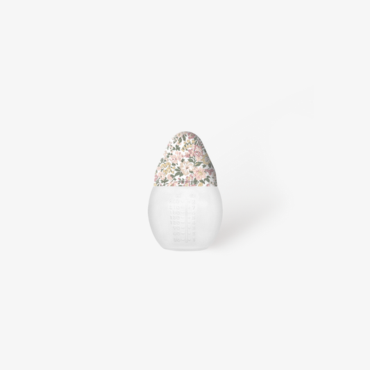 Baby Bottle with a colorful top on a white background