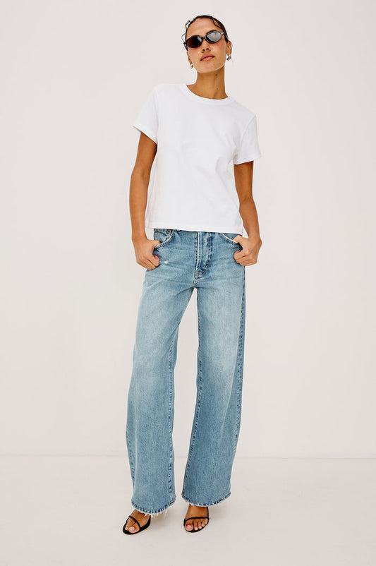 Belmont Arc Leg Jean in Rigid Denim With High-Waisted Fit, Button Fly, and 32" Inseam in Ecru Railroad Stripe Colorway - Lower Body Back View Featured on Model
