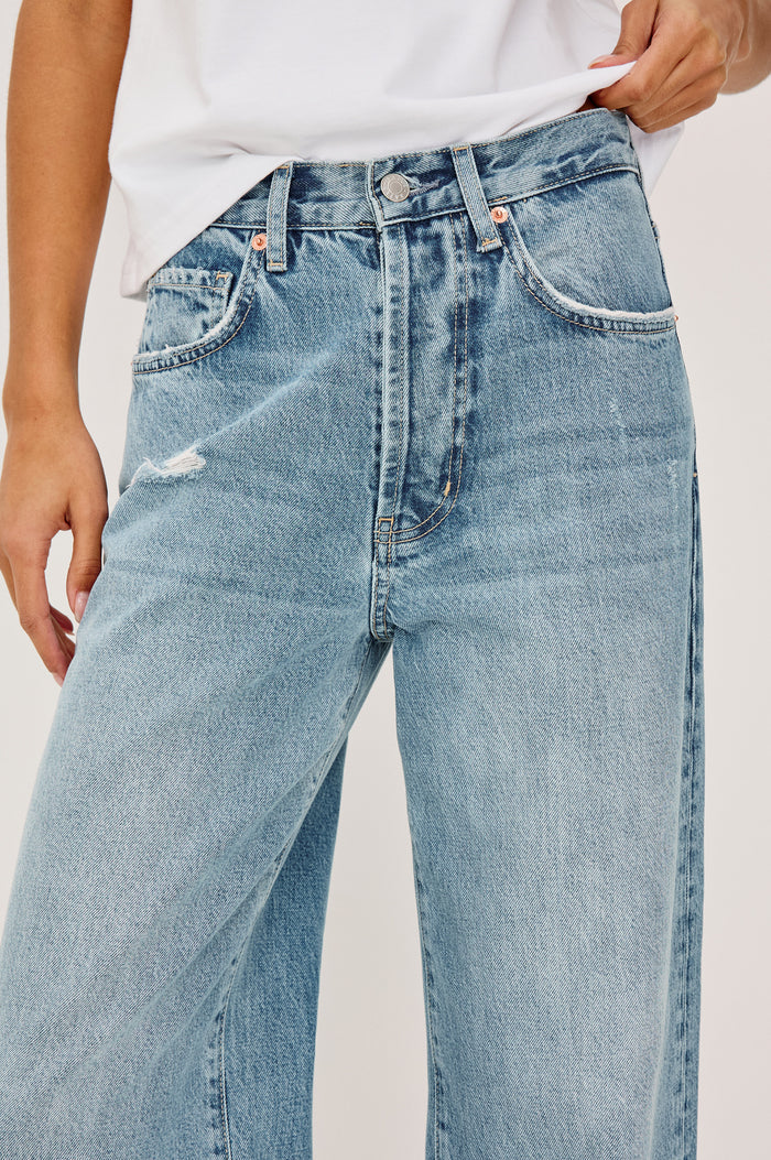 Belmont Arc Leg Jean in Rigid Denim With High-Waisted Fit, Button Fly, and 32" Inseam in Authentic Stone Colorway - Lower Body Back View Featured on Model