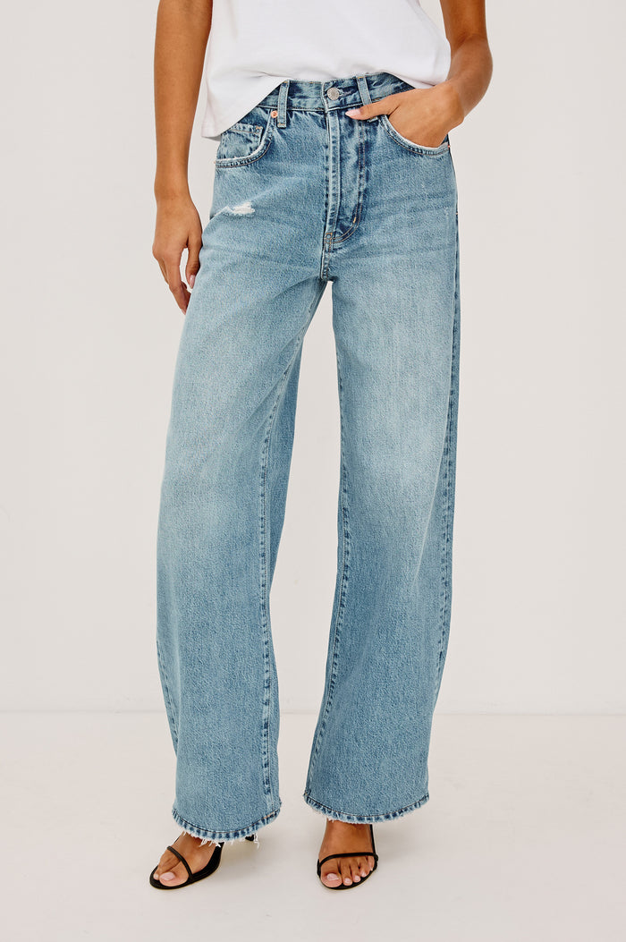 Belmont Arc Leg Jean in Rigid Denim With High-Waisted Fit, Button Fly, and 32" Inseam in Authentic Stone Colorway - Lower Body Front View Featured on Model