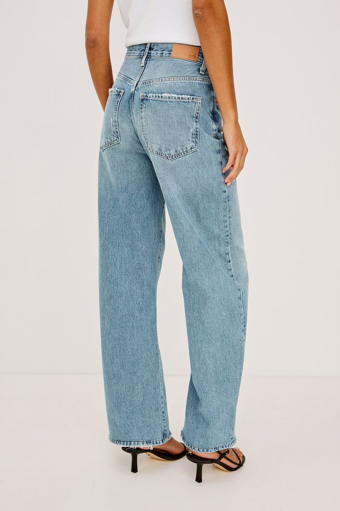Belmont Arc Leg Jean in Rigid Denim With High-Waisted Fit, Button Fly, and 32" Inseam in Authentic Stone Colorway - Lower Body Back View Featured on Model
