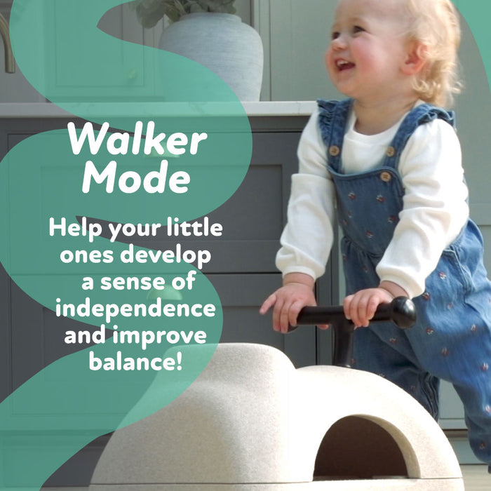 A happy toddler in blue overalls rides the Boogie Buggy | Beige 3-in-1 scooter indoors with "Walker Mode" text. Boost your child’s independence and balance!.