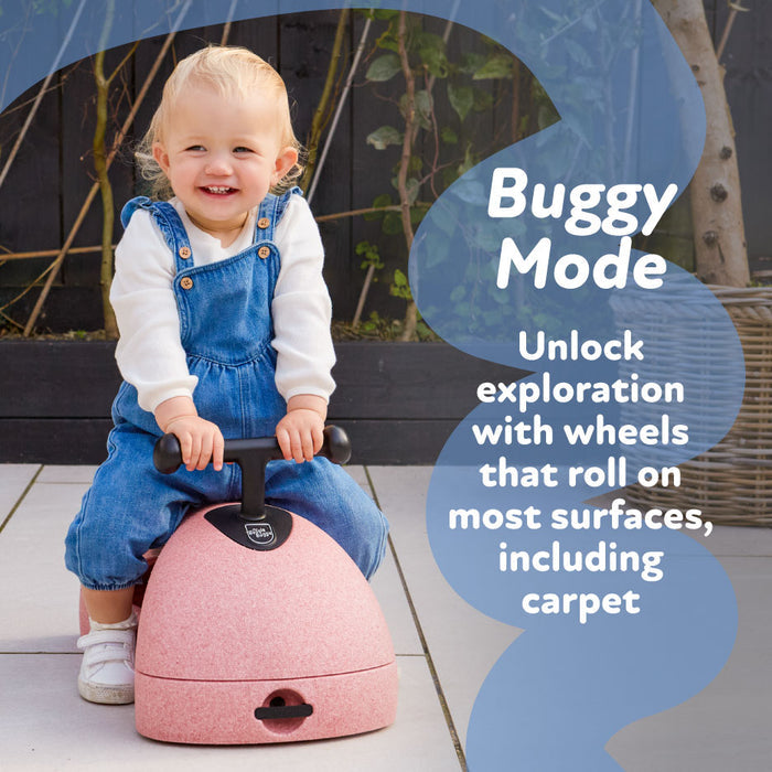 A smiling toddler in blue overalls sits on a sage Boogie Buggy 3-in-1 scooter with handlebars. Text reads: Buggy Mode. Discover smooth rides on most surfaces, including carpet, with the Boogie Buggy | Sage.