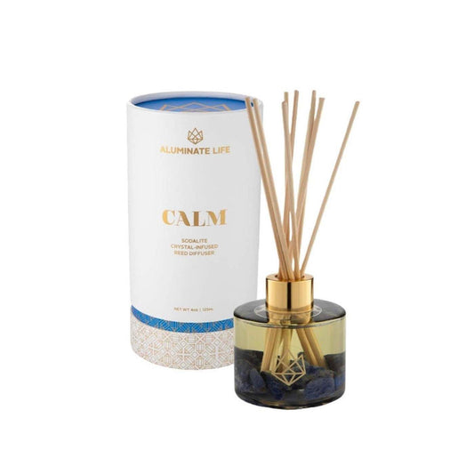 Calm Reed Diffuser | Aluminate Life featuring a gold-accented glass bottle with natural reeds and blue crystal infusion for a serene wellness atmosphere.