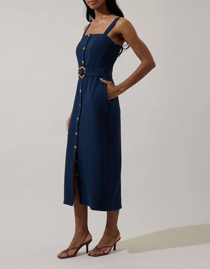 Side view of dark navy belted square neck midi dress with pockets