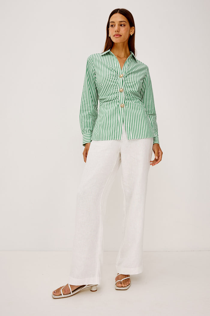 Caralyn Button-Up Shirt in Cotton Poplin With Collar, Long Sleeves, Gathered Waist, and Molded Sun Front Buttons in Emerald Stripe Colorway - Full Body Front View Featured on Model
