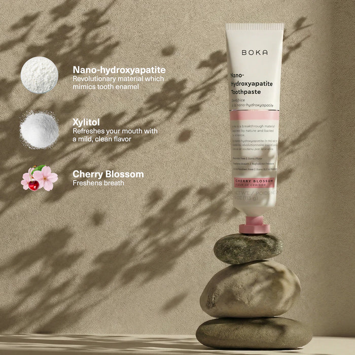 Boka toothpaste tube on stones with product features highlighted