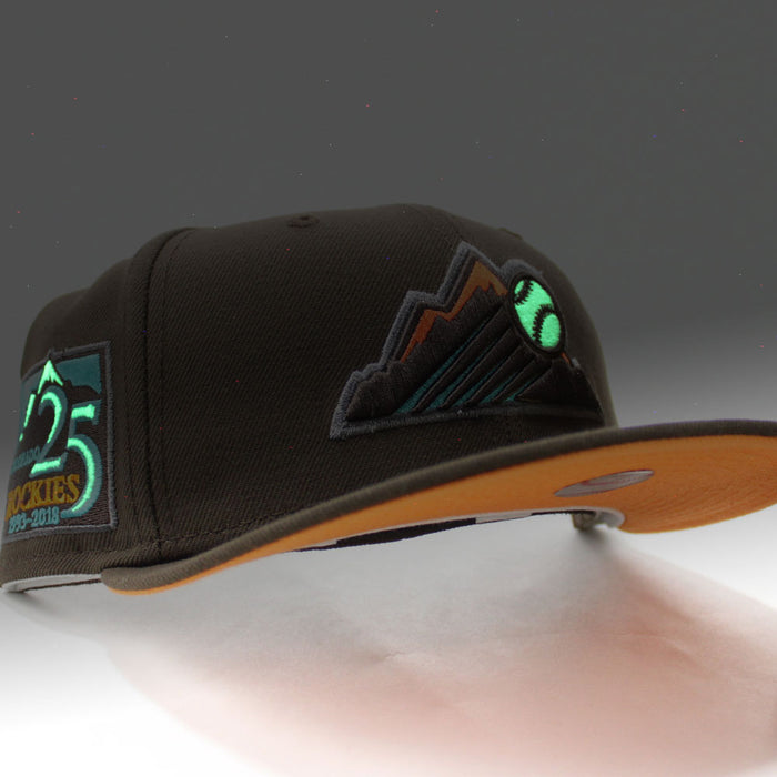 Colorado Rockies 25th Anniversary New Era 59Fifty Fitted Hat (Glow in the Dark Walnut Light Orange Pop Under Brim)