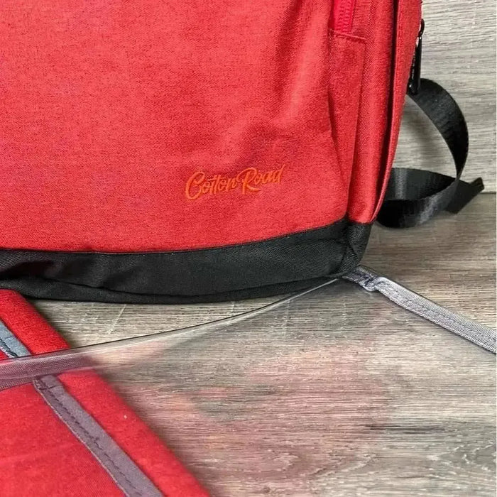 Deep red Cotton Road Nappy Bag backpack with multiple compartments and side bottle pockets