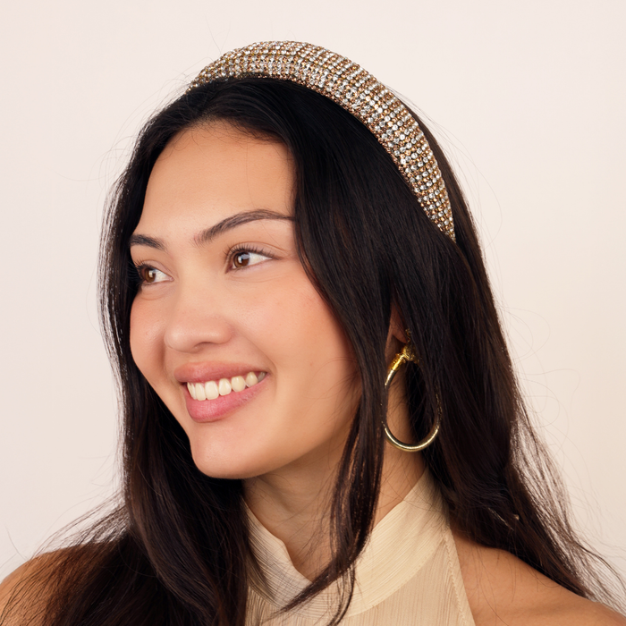 a woman smiling with a headband