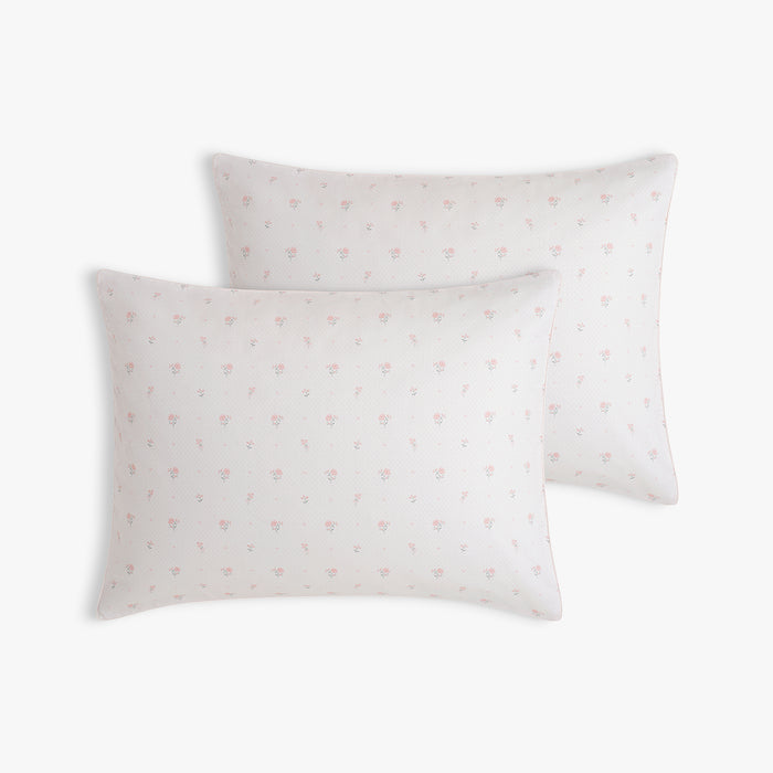 Two pillows with Ditsy Floral pattern in Pink on a white background