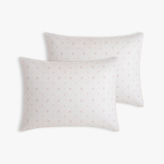 Two pillows with Ditsy Floral pattern in Pink on a white background
