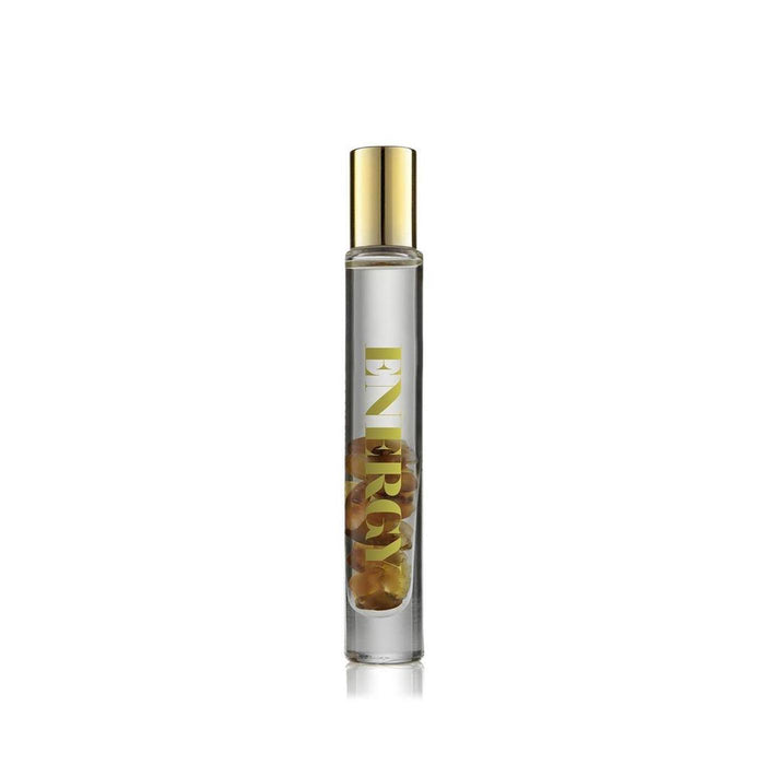 Energy Rollerball | Aluminate Life in a clear glass bottle with gold lettering and a gold cap, containing visible dried botanicals inside for wellness and body care.