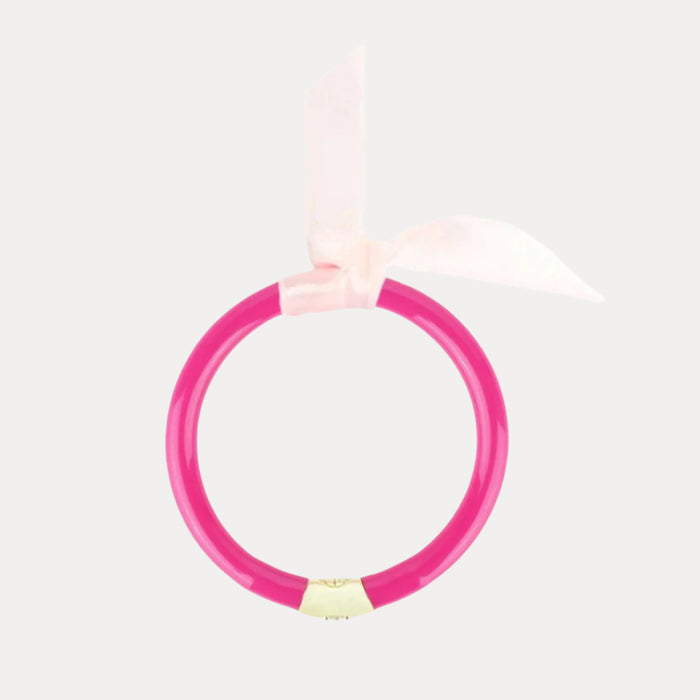 a pink ring with a bow
