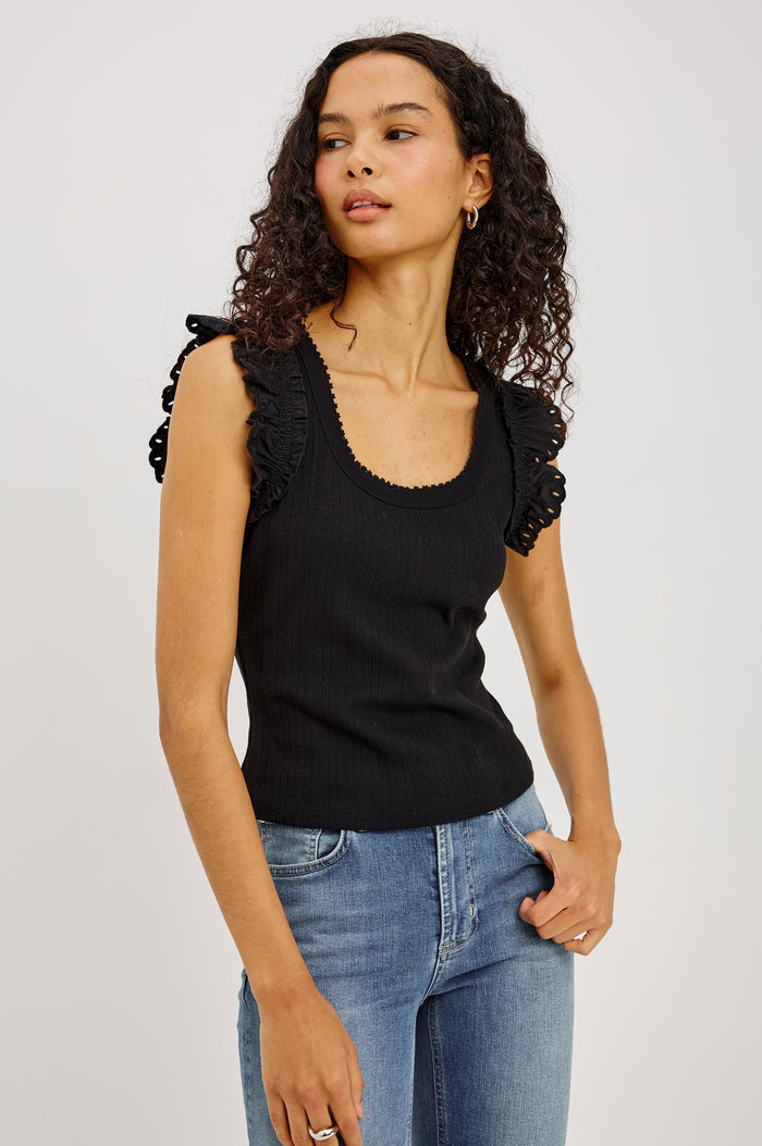 Giovanna Top in Soft Pointelle Cotton With Scoop Neck, Scalloped Trim, Ruffled Flutter Sleeves in Black Colorway - Upper Body Front View Featured on Model