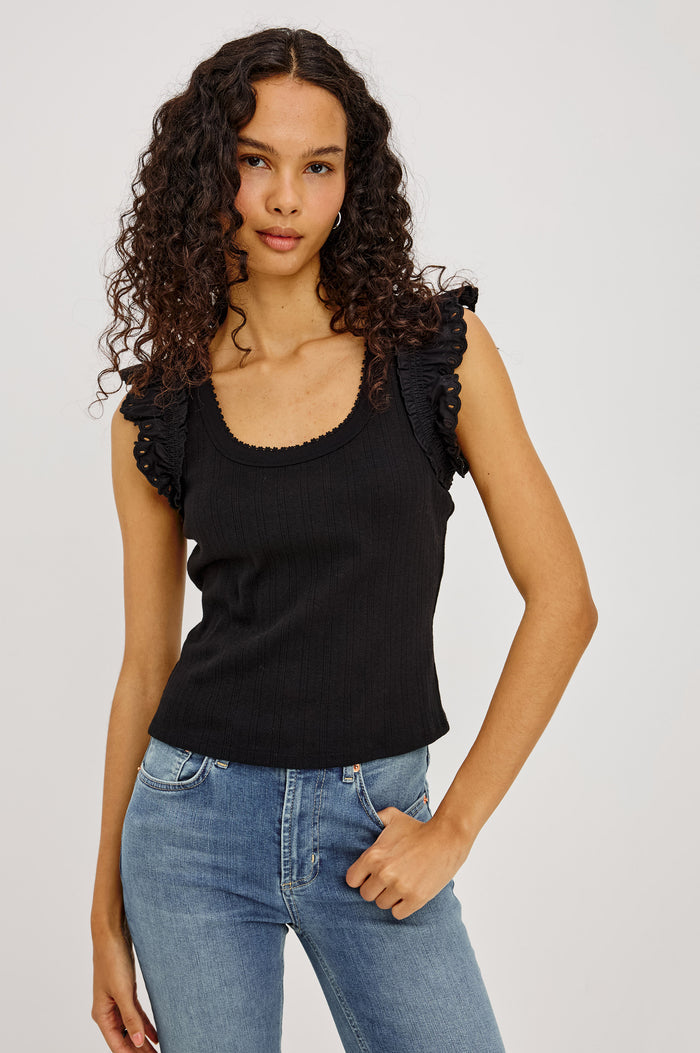 Giovanna Top in Soft Pointelle Cotton With Scoop Neck, Scalloped Trim, Ruffled Flutter Sleeves in Black Colorway - Upper Body Front View Featured on Model