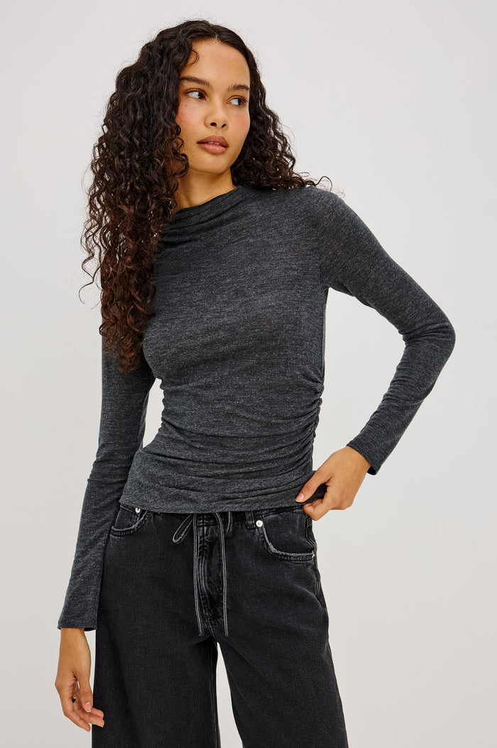 Joelle Top in Soft Jersey With High Funnel Neckline, Long Sleeves, Self-Lined Body, and Asymmetric Ruching at Shoulder and Waist in Charcoal Colorway - Upper Body Front View Featured on Model