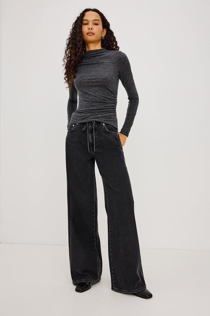Joelle Top in Soft Jersey With High Funnel Neckline, Long Sleeves, Self-Lined Body, and Asymmetric Ruching at Shoulder and Waist in Charcoal Colorway - Full Body Front View Featured on Model