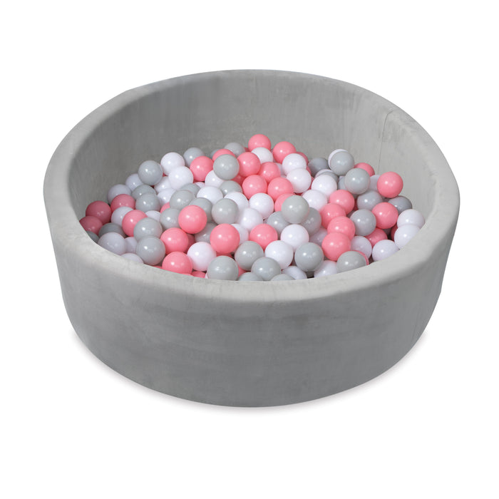 The Kids' Ball Pit for Home with 200 Balls | Pink is a round, gray foam pit filled with pink, white, and gray balls—ideal as a baby play area or kids' ball pit.
