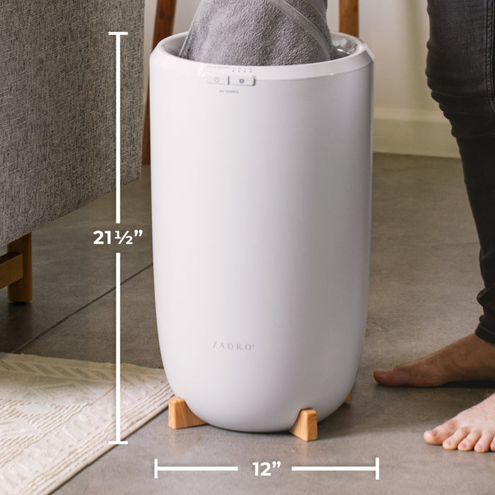 Zadro TWB01 705004422918 environment photo side view user removing towel with dimensions, large towel warmer bucket in front of a real life setting