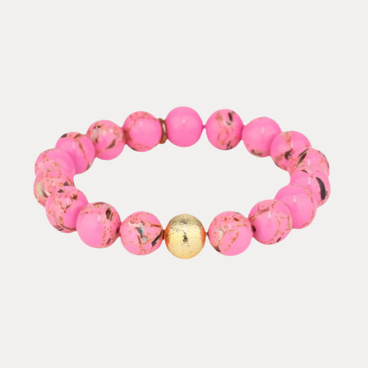 a pink and gold beaded bracelet