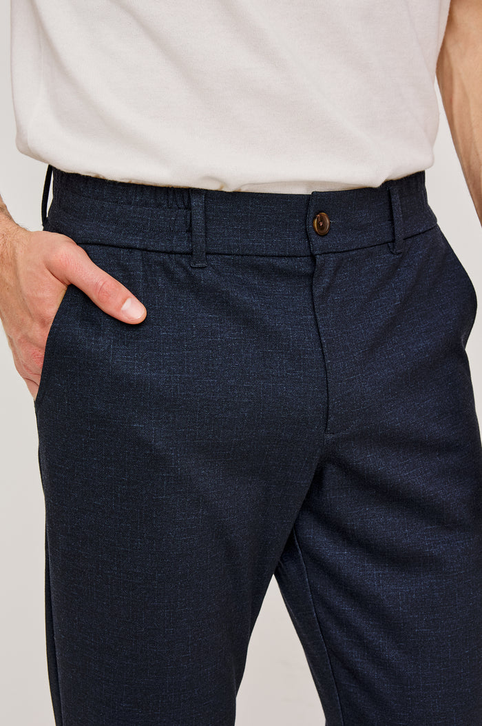 Olivier Pant With Front Belt Loops, Side Pockets, Pintuck Detailing in Navy Colorway - Lower Body Front Close-Up View Featured on Model