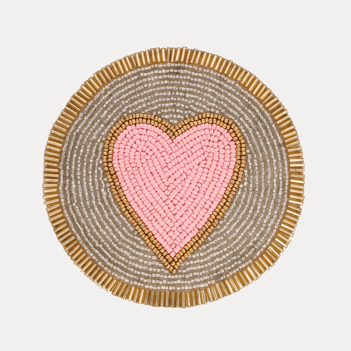 a heart shaped beaded mat