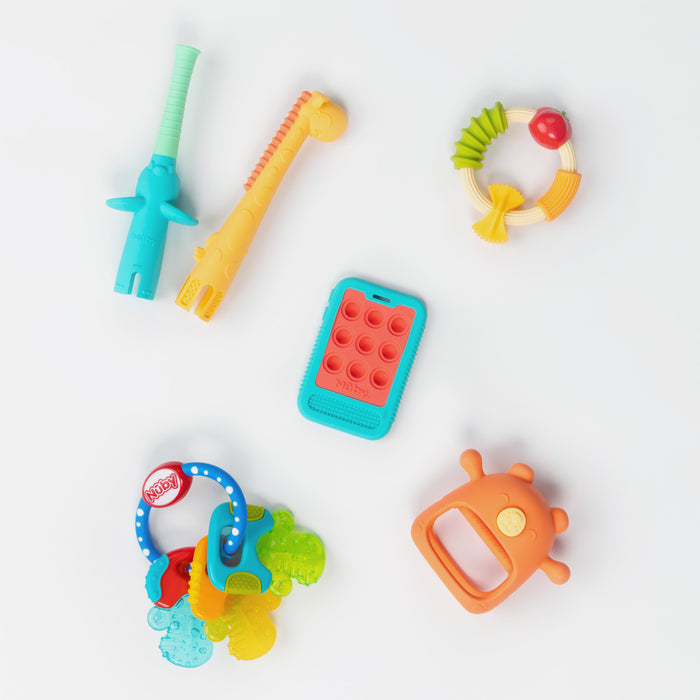 The Nuby US Pretend Play Teething Bundle includes five colorful silicone teethers—a giraffe, ring with beads, keys, pop-it rectangle, and round orange toy—designed for soothing teething relief.