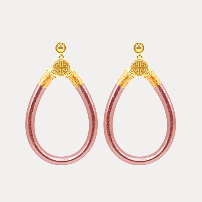 a pair of pink and gold earrings