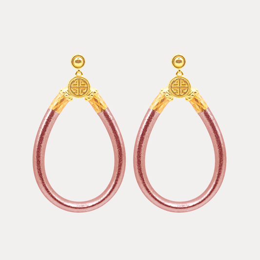 a pair of pink and gold earrings