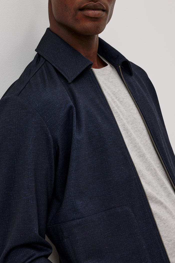 Shael Jacket in Stretch Ponte With Point Collar, Zip Front, and Double Welt Pockets in Navy Colorway - Upper Body Close Up View Featured on Model