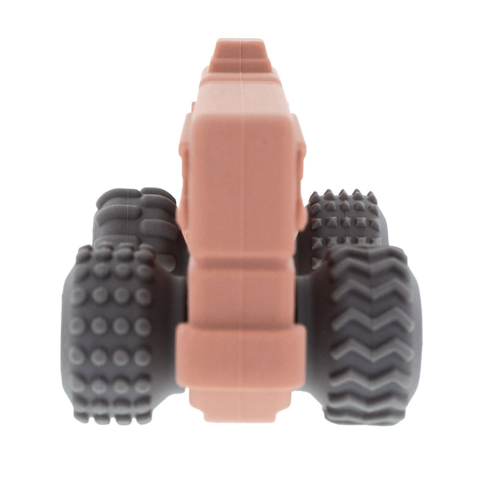 The Nuby Silicone Vehicle Teether Toy | Fire Engine is shown from the front, featuring large textured black wheels and a red body, designed as a silicone teether for babies, isolated on a white background.
