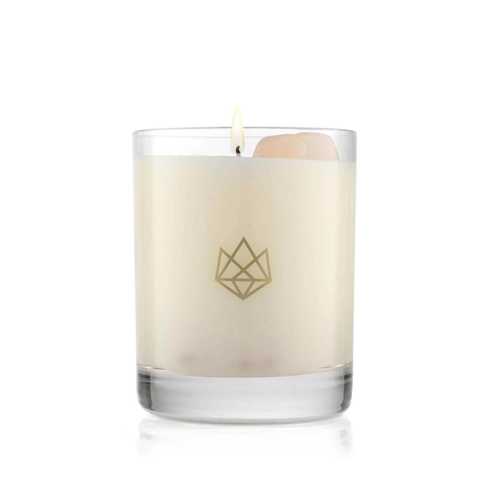Burning Sleep Glass Candle | Aluminate Life in a clear glass container with a rose quartz crystal embedded for wellness and relaxation ambiance.
