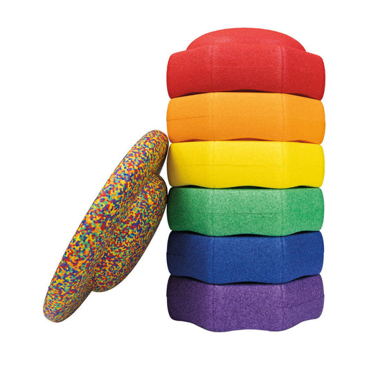 The StepPebbles and FREE Balance Board | Primary set includes six vibrant foam stepping stones and a multicolored speckled balance board, perfect for indoor or outdoor play and encouraging kids’ balance skills.