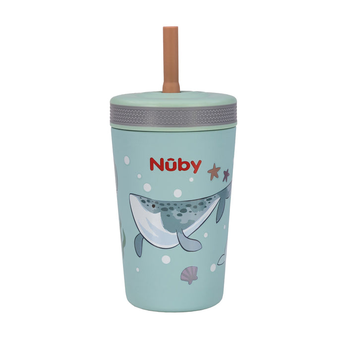 The Nuby Thirsty Kids Flexstraw Stainless Steel Cup | Whales is a light blue cup with a gray lid, tan straw, and ocean-themed design featuring whales, starfish, bubbles, and seashells. The red Nuby logo appears above the illustrations.