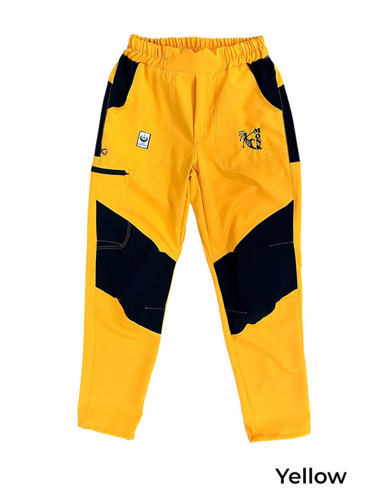 TURK MOUNTAIN men's yellow climbing pants with black reinforced knees and elastic waistband.