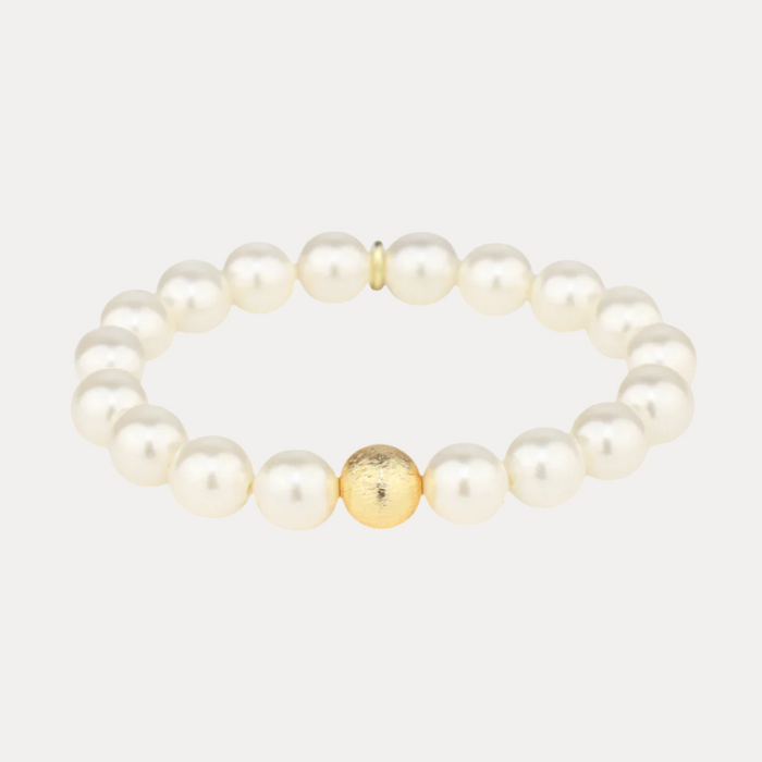 a white pearl bracelet with a gold bead