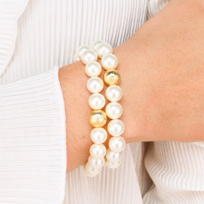 a person wearing a pearl bracelet