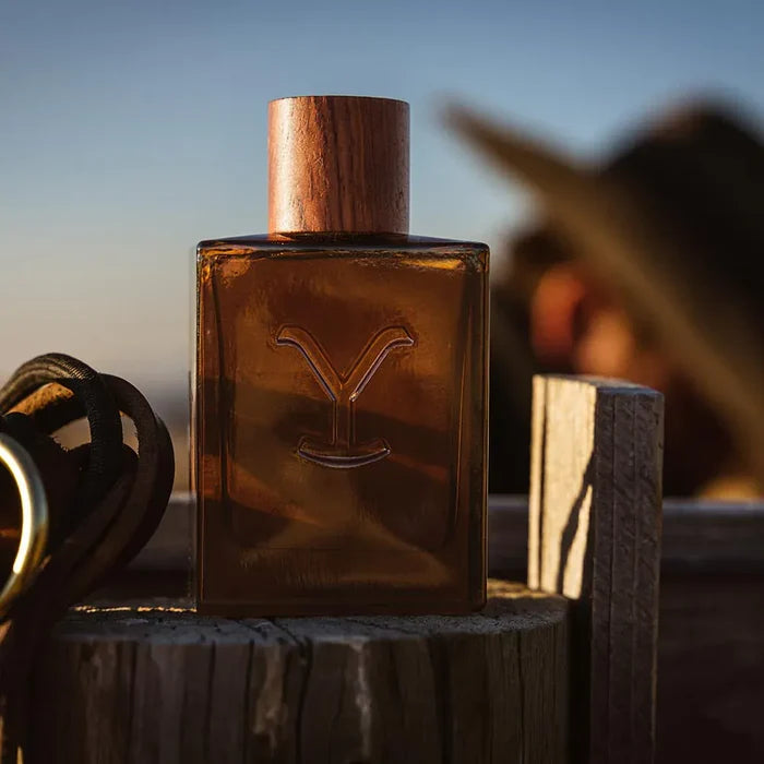 Yellowstone cologne bottle on wooden post